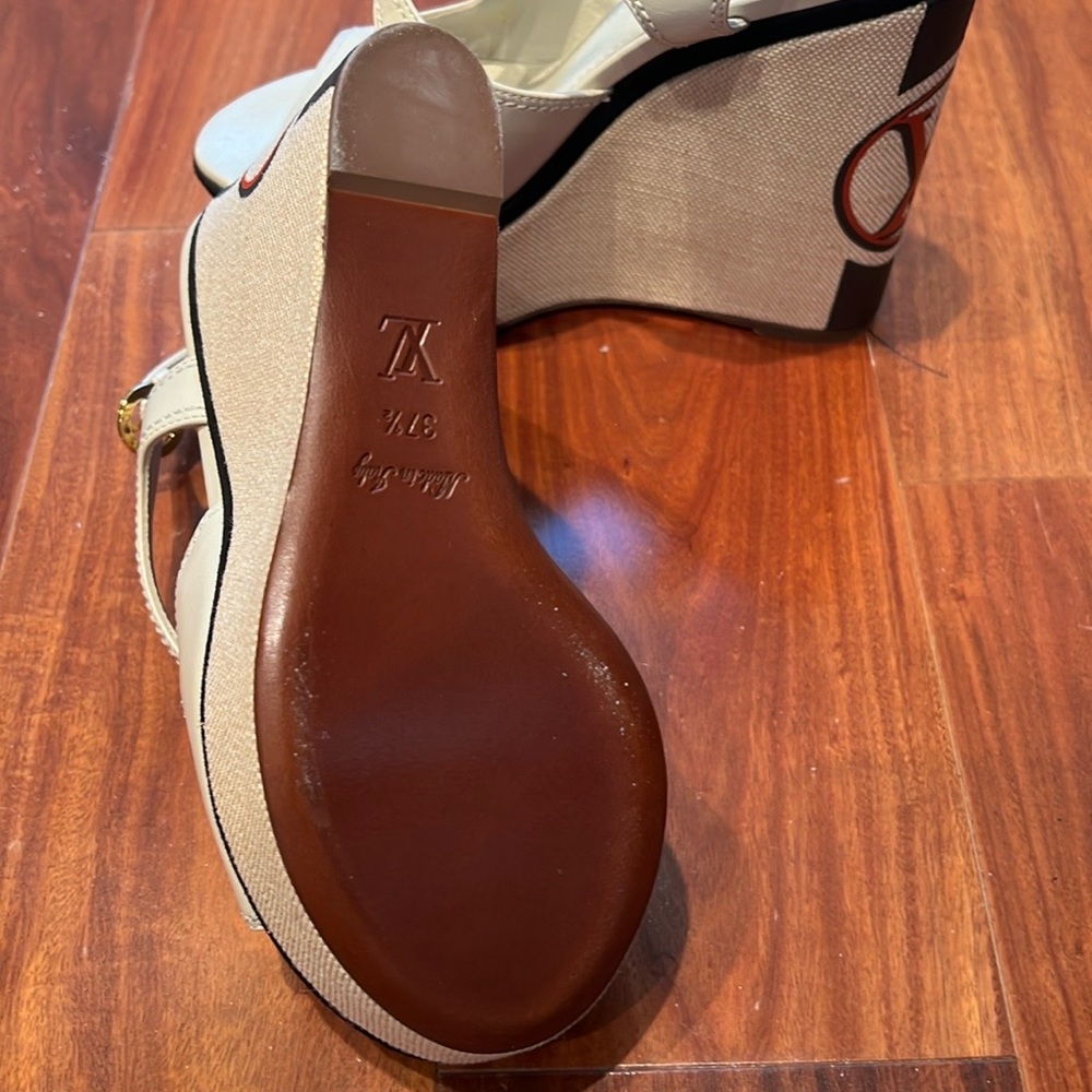 Brand new Louis Vuitton platforms, never wear. 5.5 inch wedge.Size 7 1/2.